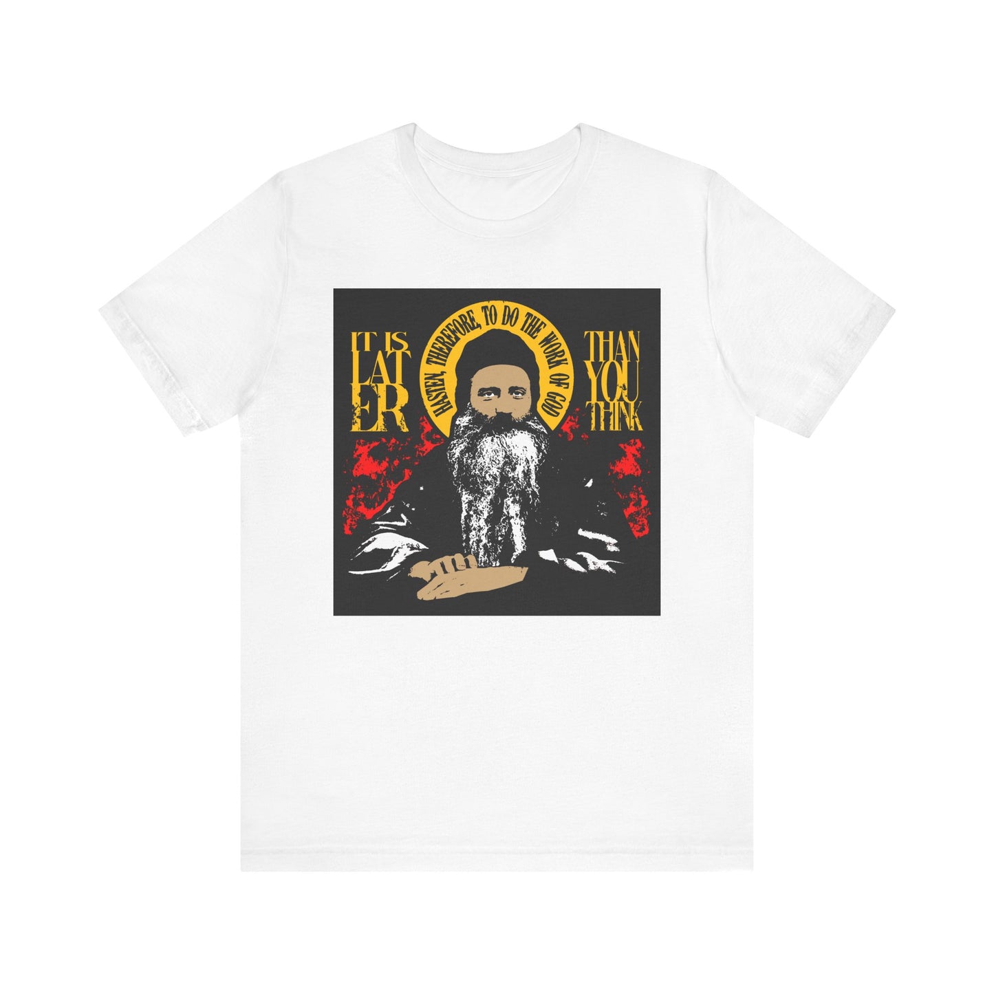 White "It is Later Than You Think, Hasten Therefore to Do the Work of God (Fr Seraphim Rose)" lightweight cotton unisex tee featuring a red and yellow graphic of a bearded man with a halo and the urgent Orthodox message—a striking reminder of spiritual discipline.