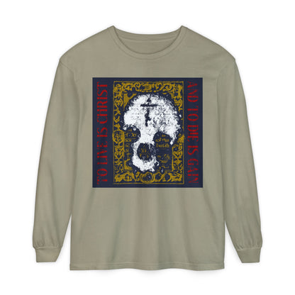 Sandstone long-sleeve shirt featuring a skull with a cross on gold manuscript texture and red "To Live is Christ, to Die is Gain" text—a bold Orthodox Christian design inspired by Philippians 1:21.