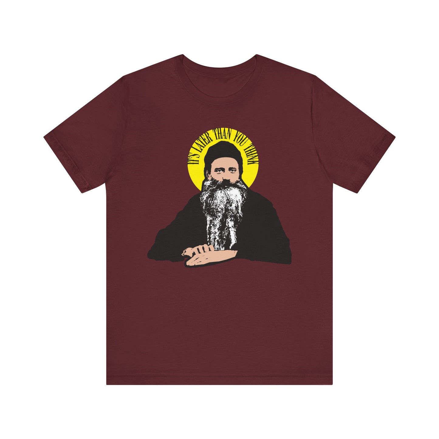 Maroon tee featuring St. Seraphim Rose with a yellow halo and the quote “It’s Later Than You Think”—a modern Orthodox saint tribute. Lightweight cotton, unisex fit.