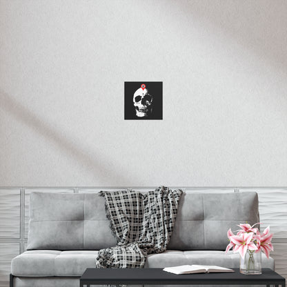 A gray sofa with a plaid throw, a coffee table with flowers and a book, and the "You Will Be Here Maps Marker on Skull Design" Orthodox Christian art poster inspire mindful reflection while elevating your decor.