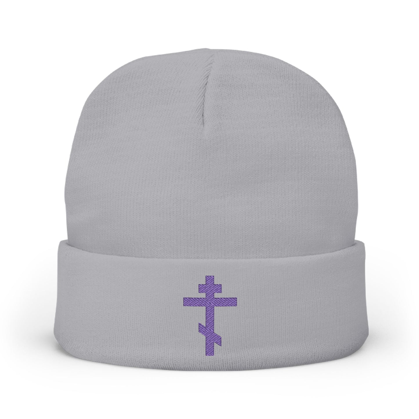 Gray knit beanie featuring a blue-purple Orthodox TriBar Cross embroidery and the phrase "Nail My Passions to the Wood of Thy Precious Cross O Lord," symbolizing faith in the Orthodox Christian tradition.
