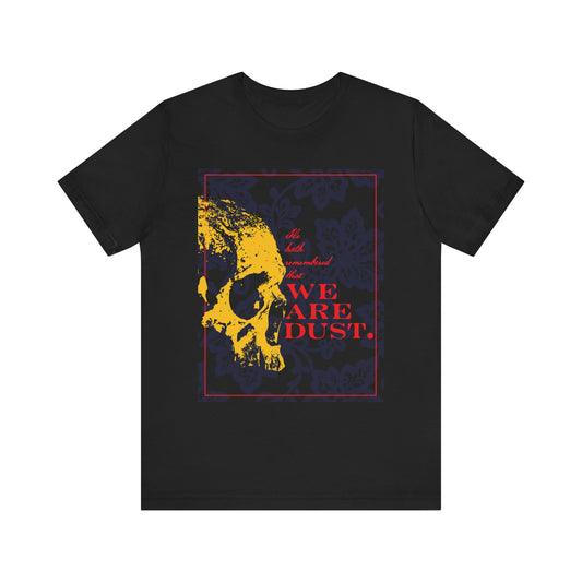 Black "We Are Dust" unisex t-shirt in lightweight cotton, featuring a yellow skull on a blue floral background with red text inspired by Psalm 102 LXX. A gothic memento mori design, reminding of the Lord's mercy.