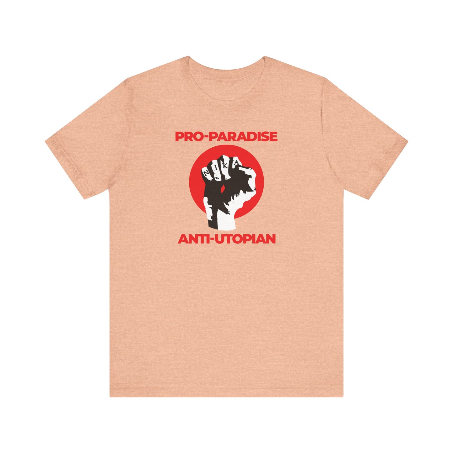 Heather peach lightweight cotton unisex tee features a NIKA fist graphic and “Pro-Paradise Anti-Utopian” text—resist the dominant secular paradigm with a design inspired by Seraphim Rose’s call to reject false utopias.