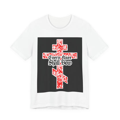 White unisex tee with a gold and red floral Orthodox cross, gothic “Every Knee Shall Bow” text, inspired by Isaiah 45:22-24 & Philippians 2:7-11. Christian design for faith and style.