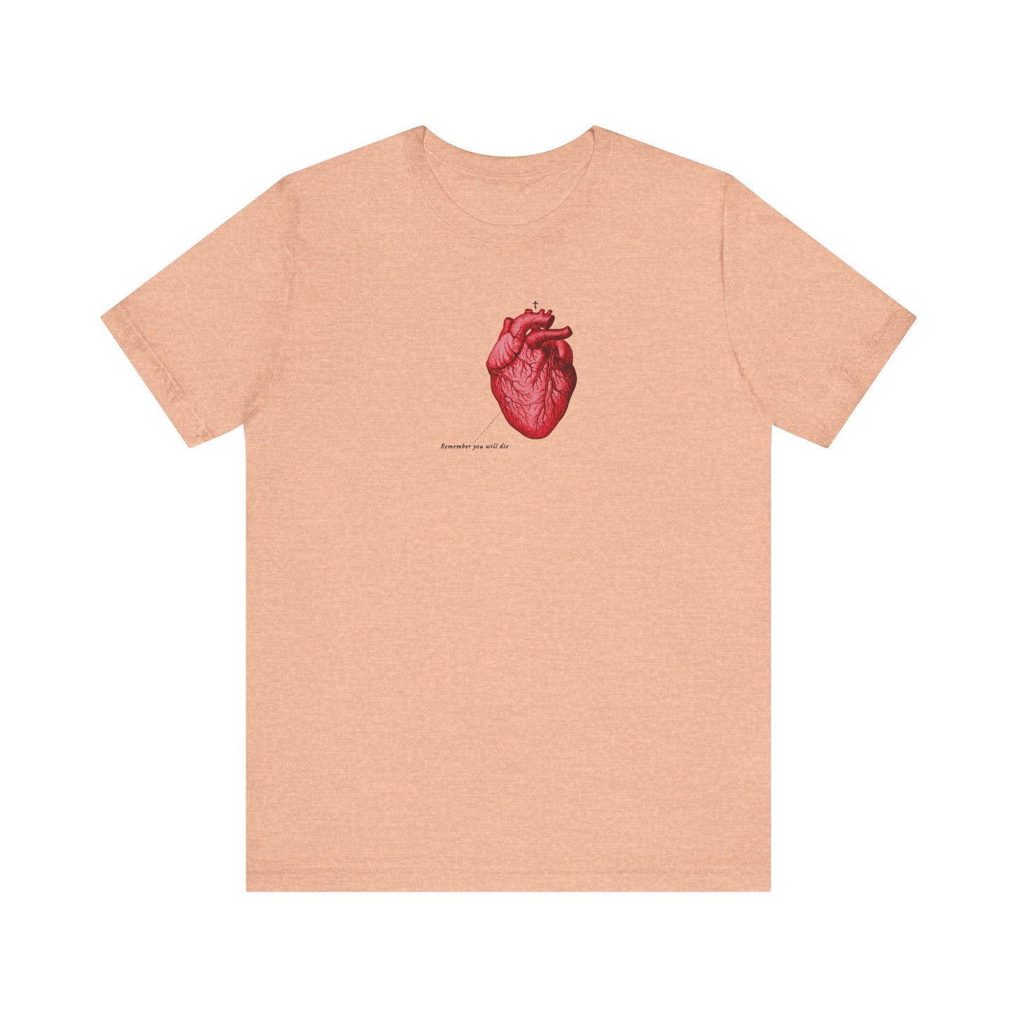 Heather peach unisex tee featuring a retro medical heart graphic, Orthodox cross, and “Remember You Will Die” memento mori message, inspired by St John. Lightweight cotton.
