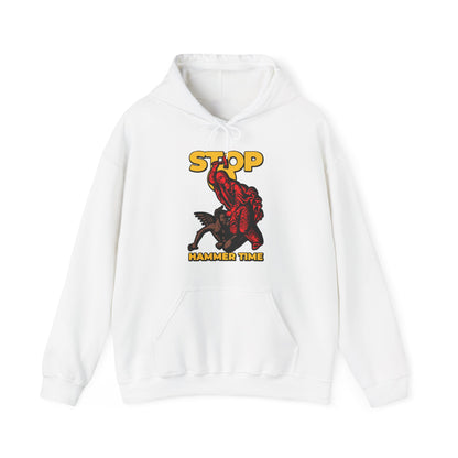 White hoodie with a red St Marina of Antioch beating the devil with a hammer, yellow text "STOP HAMMER TIME"—a modern Orthodox meme in red, blue, and yellow. Christian design inspired by courage.