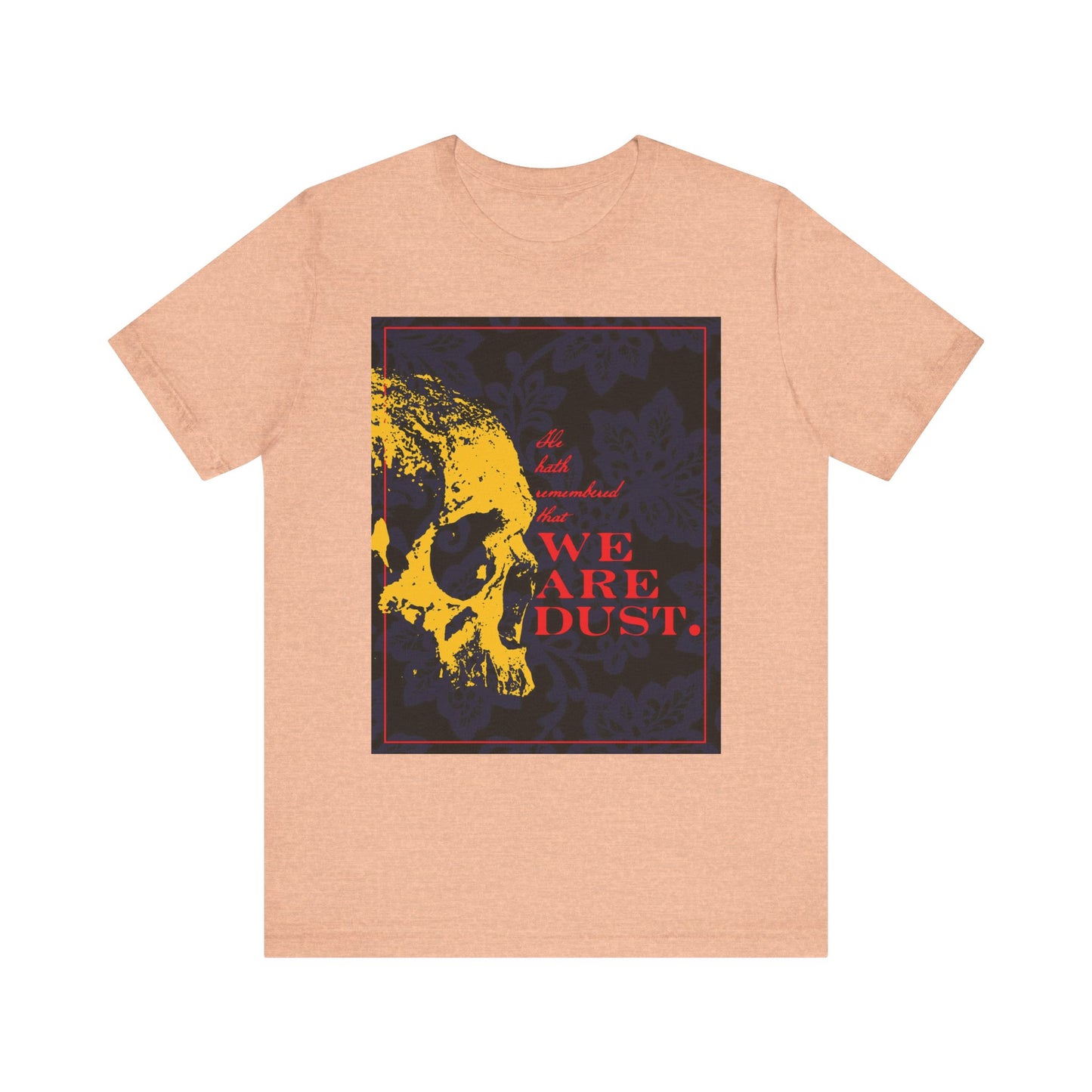 Heather Peach unisex t-shirt featuring a yellow skull and bold red "We Are Dust" text, inspired by Psalms, set on a blue floral background. Gothic memento mori design in lightweight cotton.