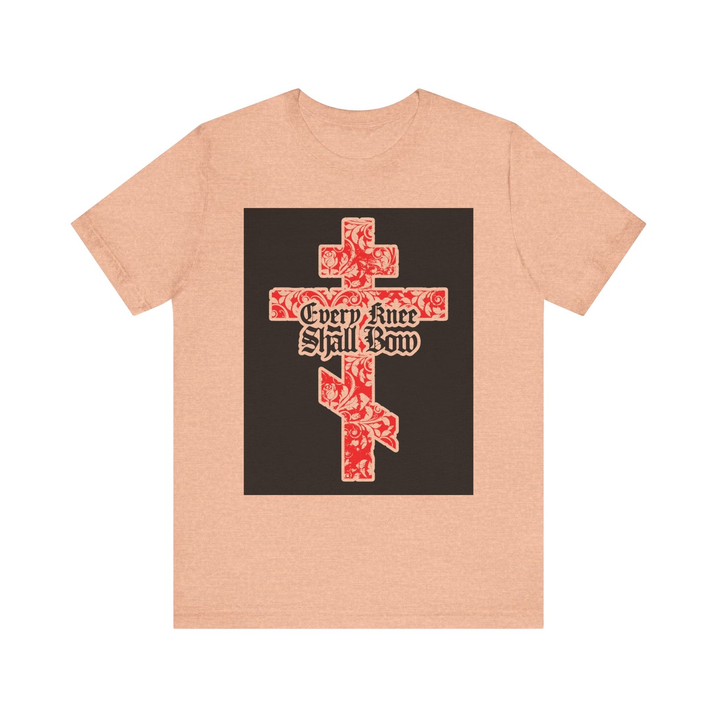 Heather Peach unisex tee featuring a gold and red floral textured Orthodox cross with Gothic "Every Knee Shall Bow" text, inspired by Isaiah 45:22-24 & Phil 2:7-11. Lightweight cotton for comfort.