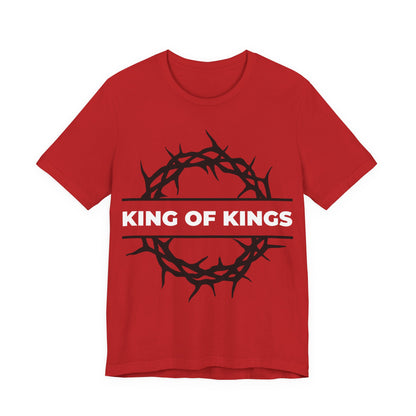 Red "King of Kings Crown of Thorns" unisex cotton tee features a black crown of thorns and bold white lettering, inspired by Revelation 19:16—Christ is King, the King of Glory. Orthodox Christian design.