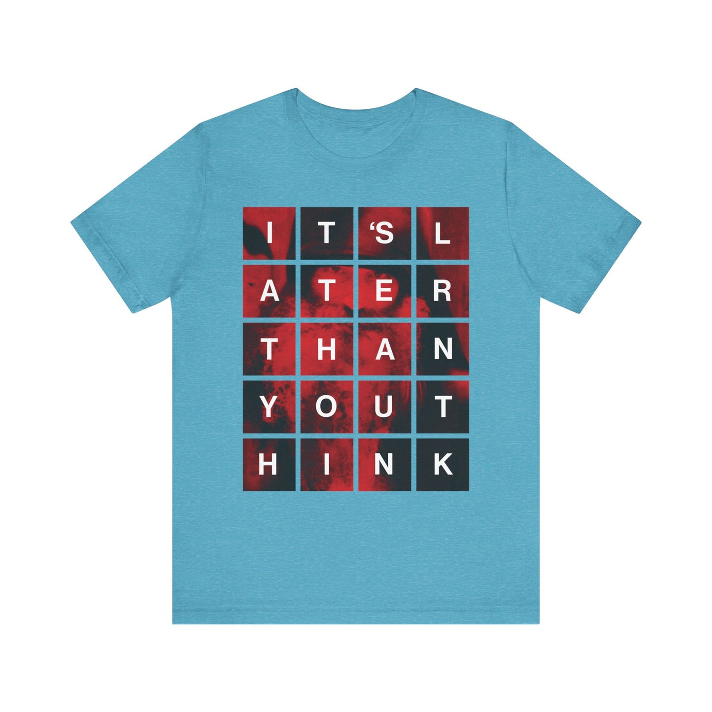 Heather aqua t-shirt featuring a modern block grid design that reads "It's Later Than You Think"—inspired by St. Seraphim Rose and serving as a thoughtful Orthodox Christian reminder of repentance and the urgency of seeking salvation.