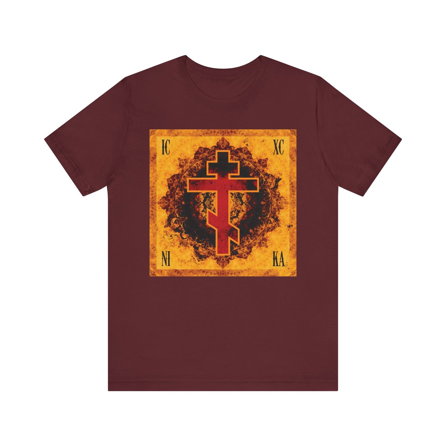 Maroon ICXC NIKA Lightweight Cotton Unisex T-Shirt featuring an ornate Orthodox cross in bright orange and red on a distressed yellow-orange square background, inspired by the Elevation of the Precious Cross.