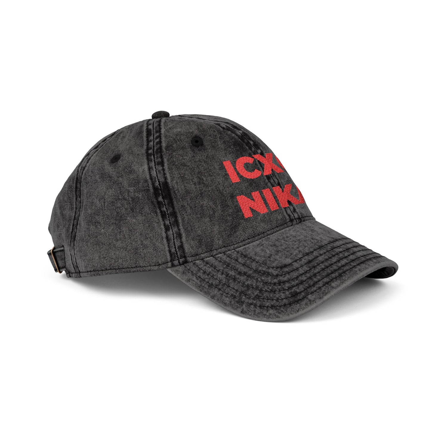 Distressed black denim cap, shown at an angle, features red "ICXC NIKA"—the Orthodox Christian Christogram meaning "Jesus Christ Conquers"—embroidered on the front. Product: Red ICXC NIKA Text Christogram Distressed Denim Cap.