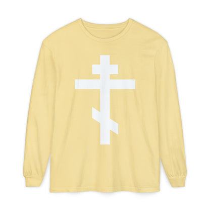 Butter-colored long sleeve shirt featuring a large white Orthodox Cross and the message, “May I never boast, except in the cross of our Lord Jesus Christ” (Gal 6:14). Inspired by St. John of Kronstadt.