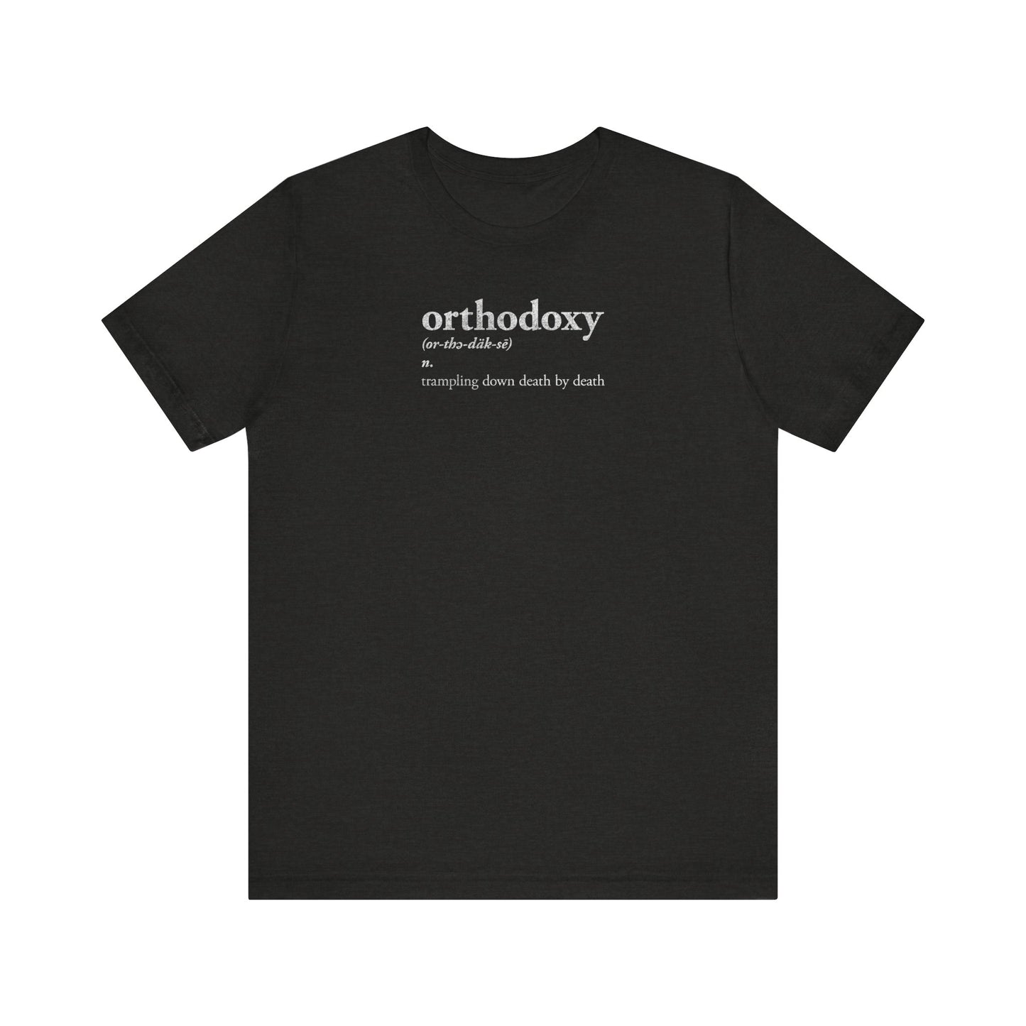 Black Heather t-shirt featuring the "Orthodoxy Definition: Trampling Down Death By Death | Christ is King | Memento Mori | Pascha" design in white text, centered near the collar and inspired by the solemn chant of "Lord I Have Cried" from Tone 2 Resurrection Great Vespers; lightweight cotton unisex tee.