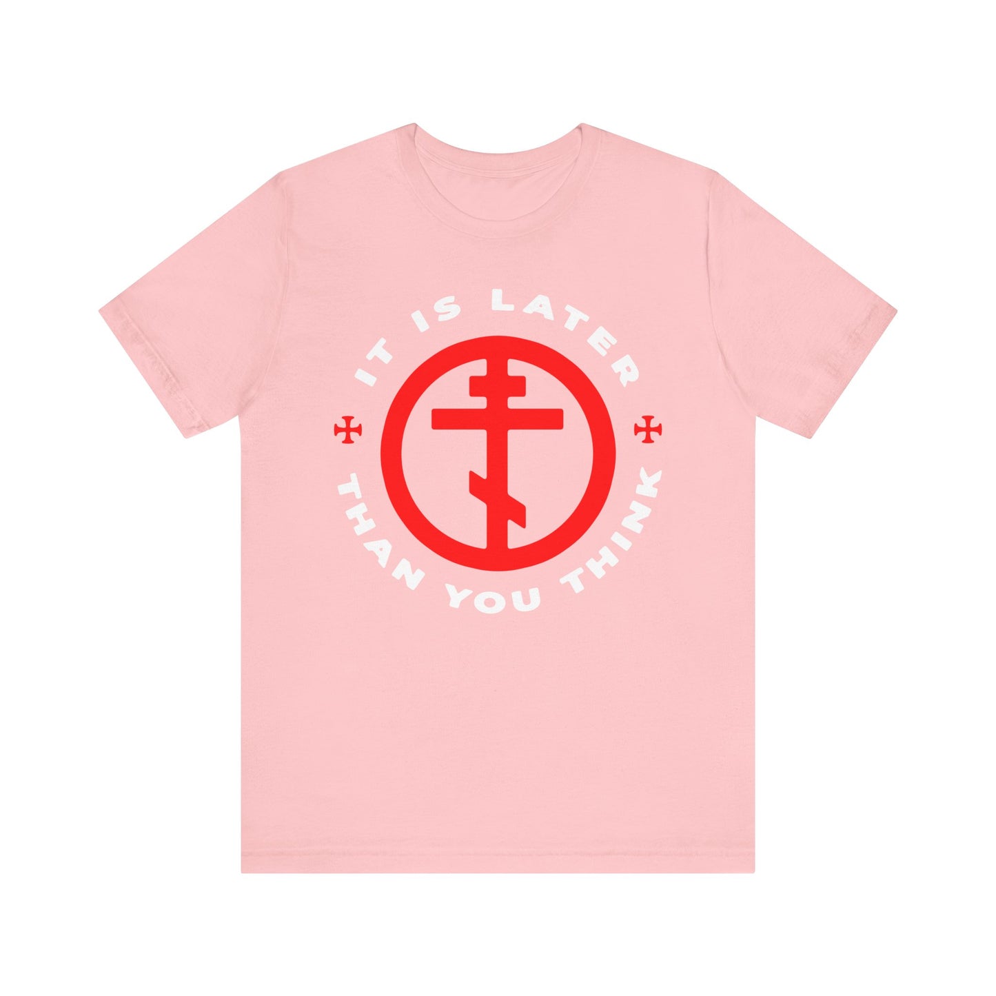 This pink lightweight cotton unisex tee, inspired by Fr Seraphim Rose and featuring the phrase "It Is Later Than You Think" in a circular design with a red cross symbol, serves as an Orthodox memento mori—encouraging you to put on the armor of light and turn away from darkness.