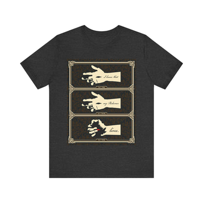Dark Grey Heather t-shirt featuring three illustrated hands of the crucified Christ, ornate frames, and the text "I Know That My Redeemer Lives" (Job 19:25), reflecting resurrection and Orthodox Christian themes.