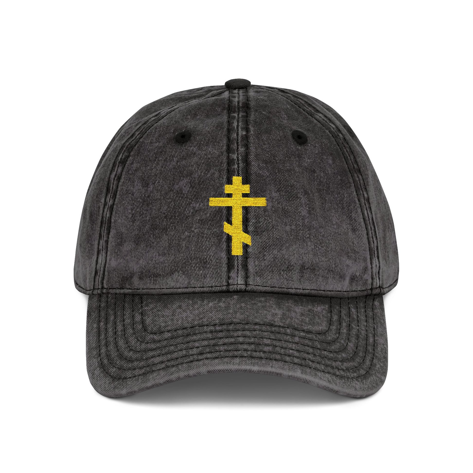 Black distressed cap with a minimalist yellow Orthodox TriBar Cross and "Crucify My Ego to the Precious and Life Giving Cross" embroidered on front—a simple statement of faith.