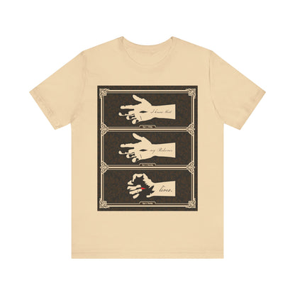 Soft cream t-shirt featuring an illustrated hand of the Crucified Christ with the text “I Know That My Redeemer Lives” (Job 19:25), in an earthtone Americana style, reflecting Orthodox Christian themes of resurrection and hope.