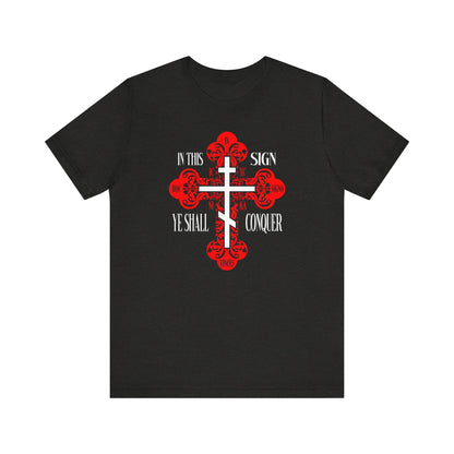 Black Heather unisex tee featuring an ornate Orthodox cross with "In This Sign Ye Shall Conquer," "ICXC NIKA," and "Jesus Christ Conquers"—a bold symbol of Christian faith and victory.