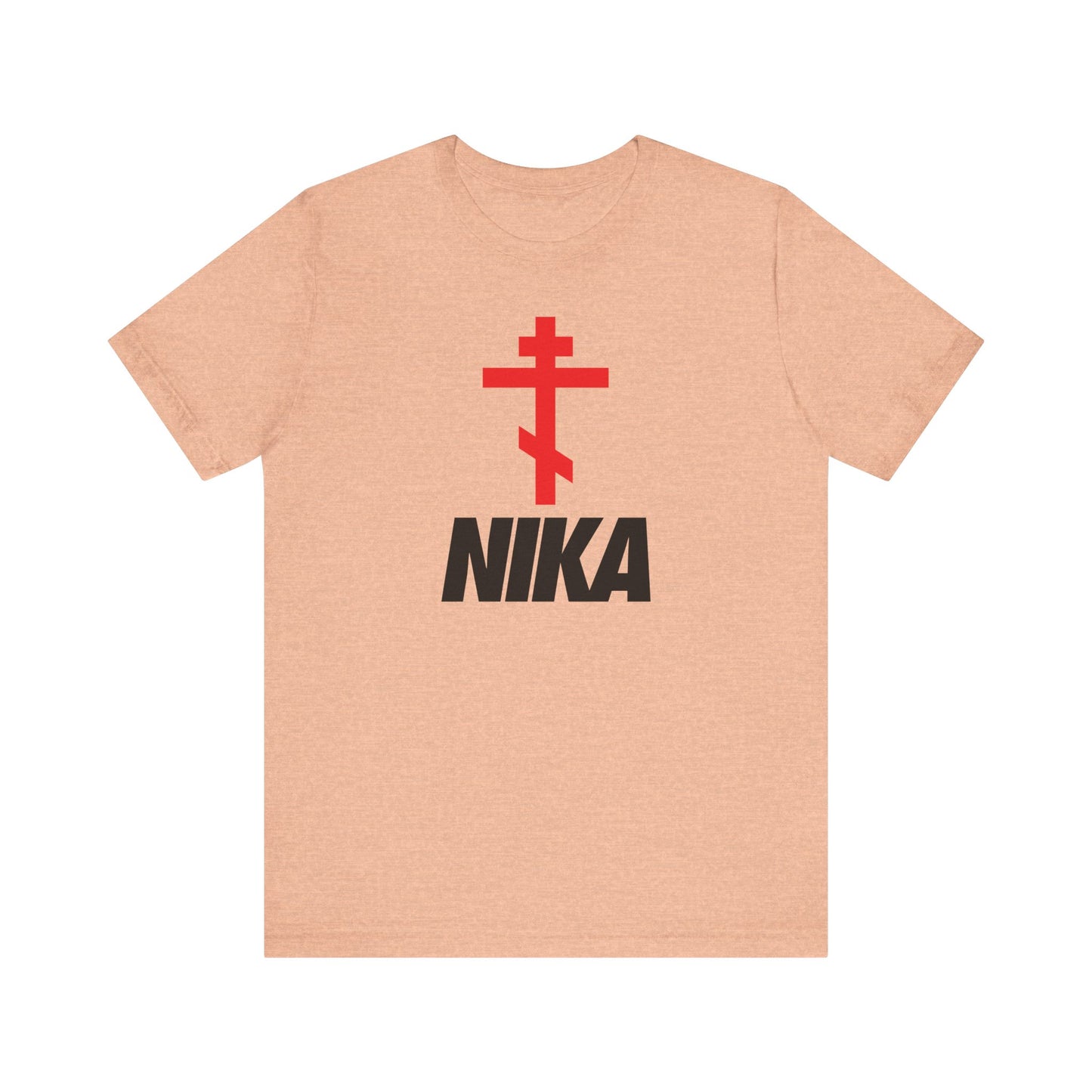 Heather peach unisex tee featuring an Orthodox cross above bold NIKA text—a minimalist Christogram ("Jesus Christ Conquers")—inspired by the NIKE logo. Lightweight cotton; athletic ascetic fashion for Christians.