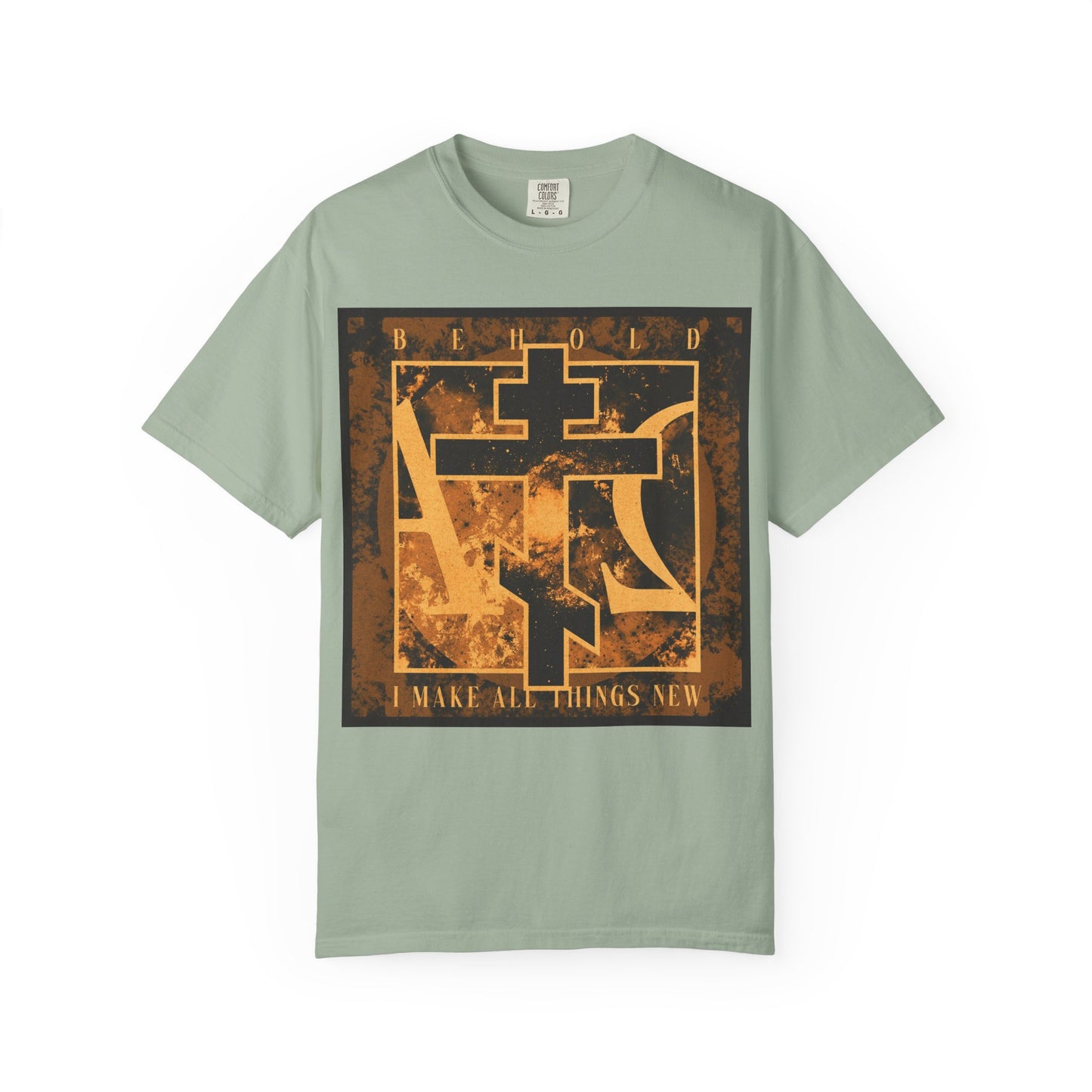 Bay-colored heavyweight cotton unisex T-shirt featuring a brown and orange Orthodox cross with an Alpha & Omega background and the text "Behold, I make all things new," inspired by Revelation 21:5 and the promise of a renewed creation.