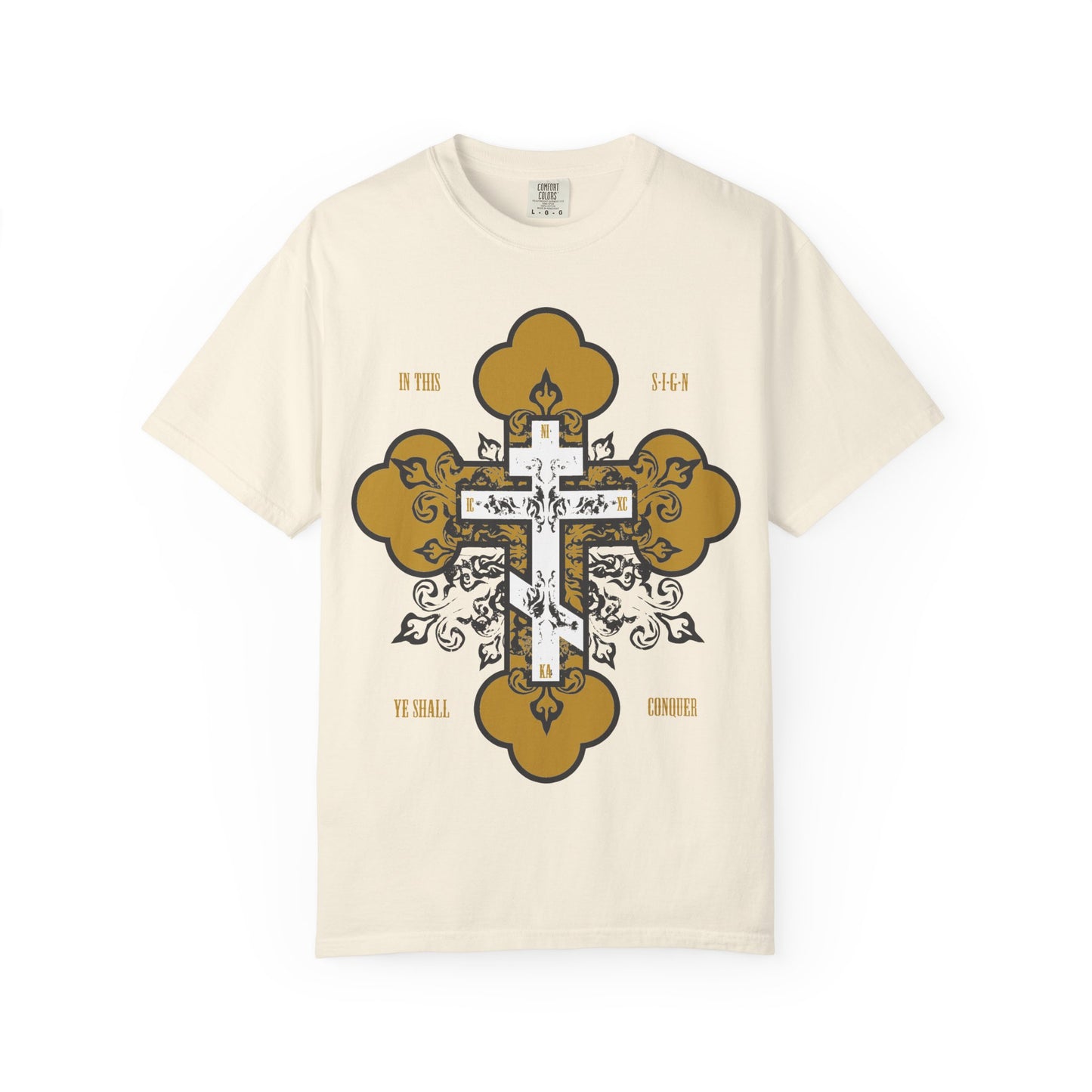 Ivory heavyweight cotton unisex tee featuring a gold and white ornate Orthodox cross with floral accents. This bold Christian inspirational shirt displays the phrase IN THIS YE SHALL CONQUER (In Hoc Signo Vinces) across the front.