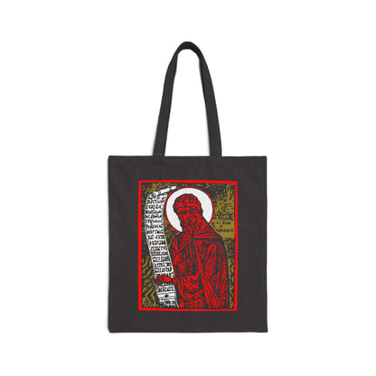 Black cotton tote bag with a high-contrast red and gold graphic inspired by St. John of Damascus Orthodox funeral hymns, featuring an iconic figure holding a scroll.