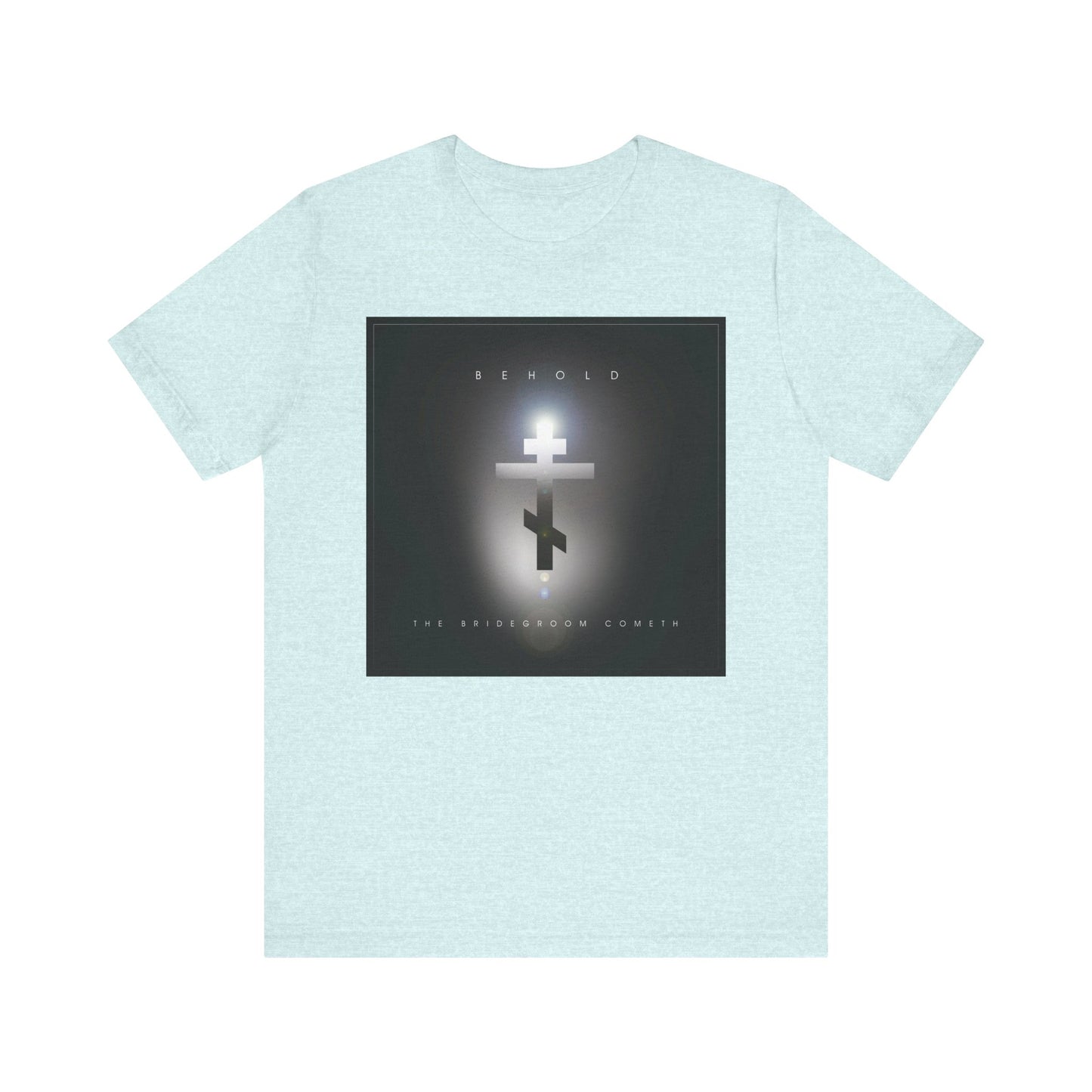 The Behold the Bridegroom Minimalist Cinematic Lens Flare Orthodox Christian T-shirt in Heather Prism Ice Blue features a glowing cross and the words "Behold The Bridegroom Cometh," inspiring vigilance for the day of judgment.