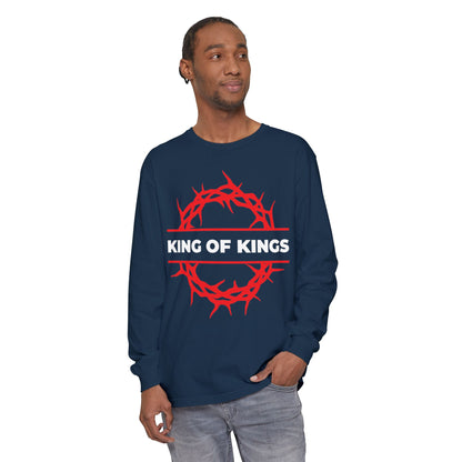 A man stands sideways wearing the "King of Kings Crown of Thorns | The King of Glory | Christ is King | Revelation 19:16" Christian cotton long sleeve shirt in navy, featuring a red crown of thorns graphic inspired by scripture.