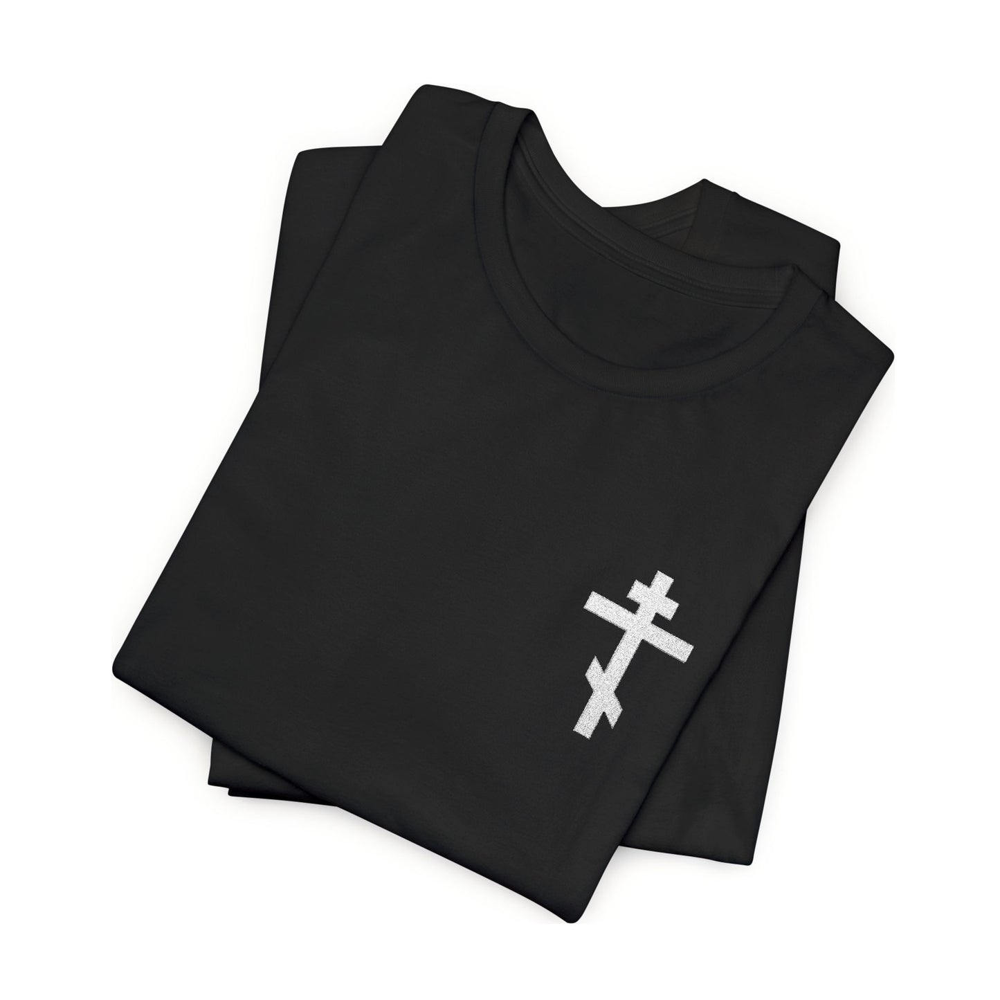 Folded black t-shirt featuring a small embroidered white Orthodox cross, inspired by Gal 6:14 and the message "May I Never Boast Except in the Cross of Our Lord Jesus Christ"—a perfect Christian gift.