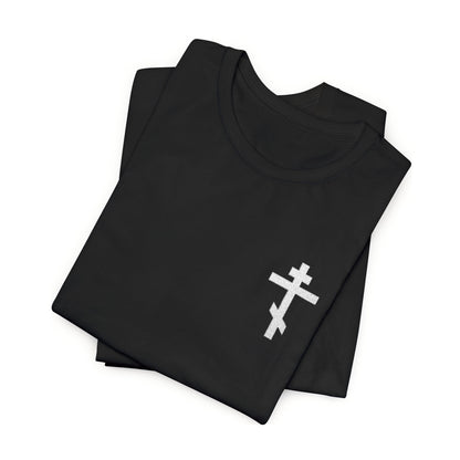 Folded black t-shirt featuring a small embroidered white Orthodox cross, inspired by Gal 6:14 and the message "May I Never Boast Except in the Cross of Our Lord Jesus Christ"—a perfect Christian gift.