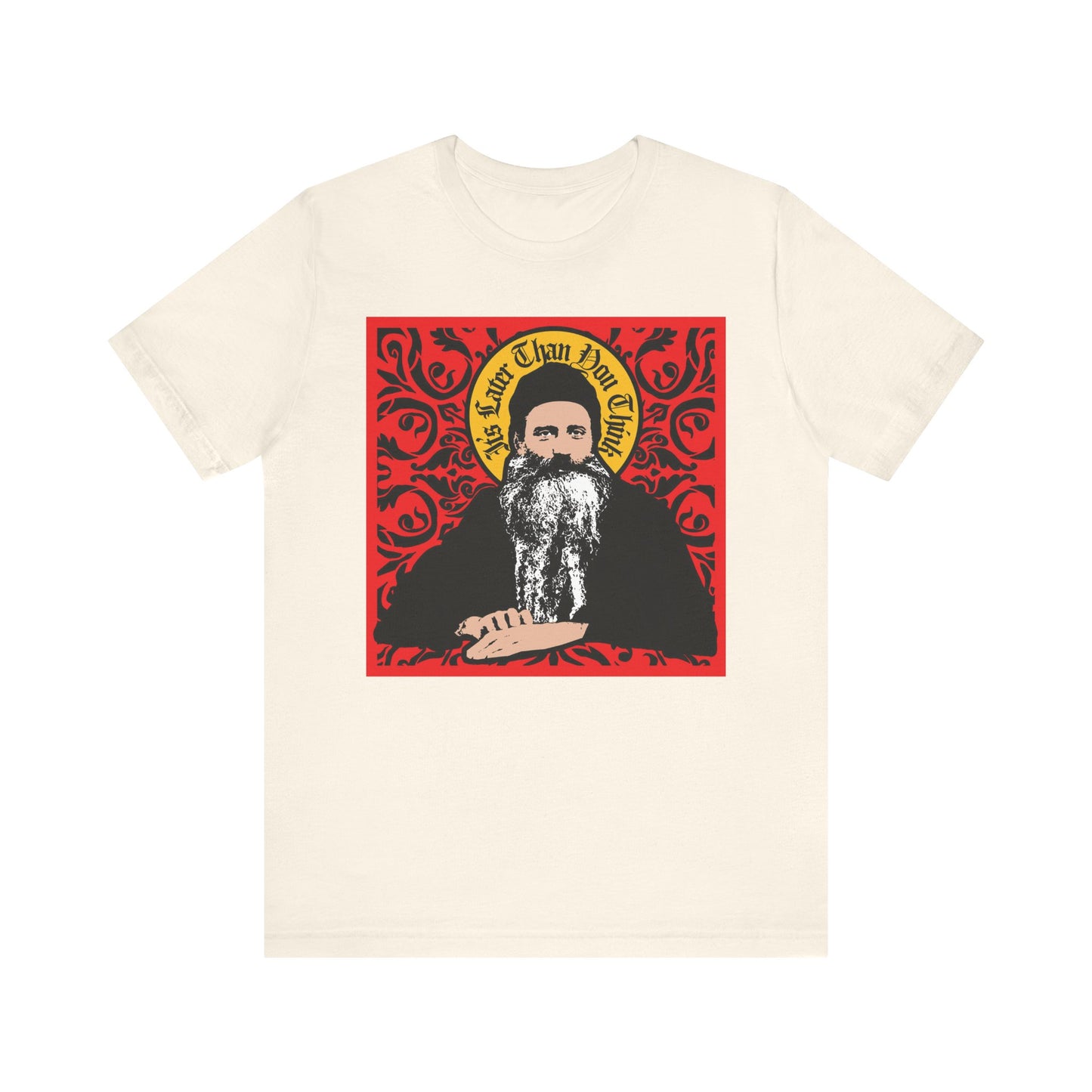 Natural unisex tee featuring a red ornate Saint Seraphim Rose of Platina icono-graphic design and the phrase "It's Later Than You Think." Lightweight cotton.