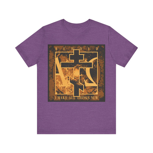 Heather Team Purple cotton t-shirt featuring a bold brown and orange Orthodox cross with Alpha & Omega background and the text "Behold, I Make All Things New (Rev 21:5)" on the front.