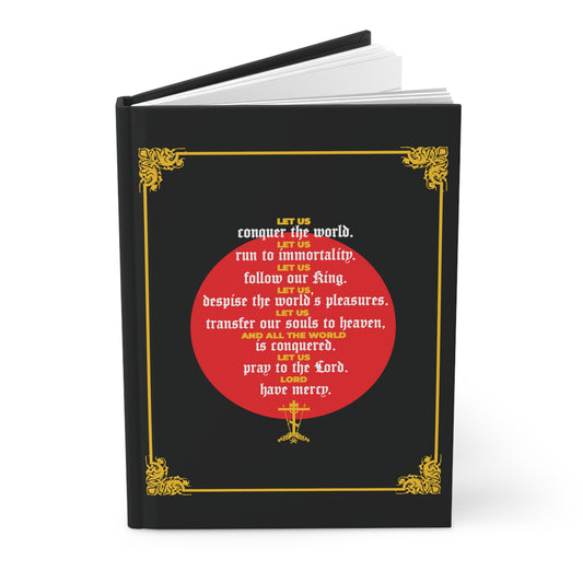 Black hardcover journal with a gold border, red circle, and centered inspirational white text quoting St John Chrysostom: "Let Us Conquer the World, Let Us Run To Immortality" from Unseen Warfare; Ascetic Christian Orthodox design.