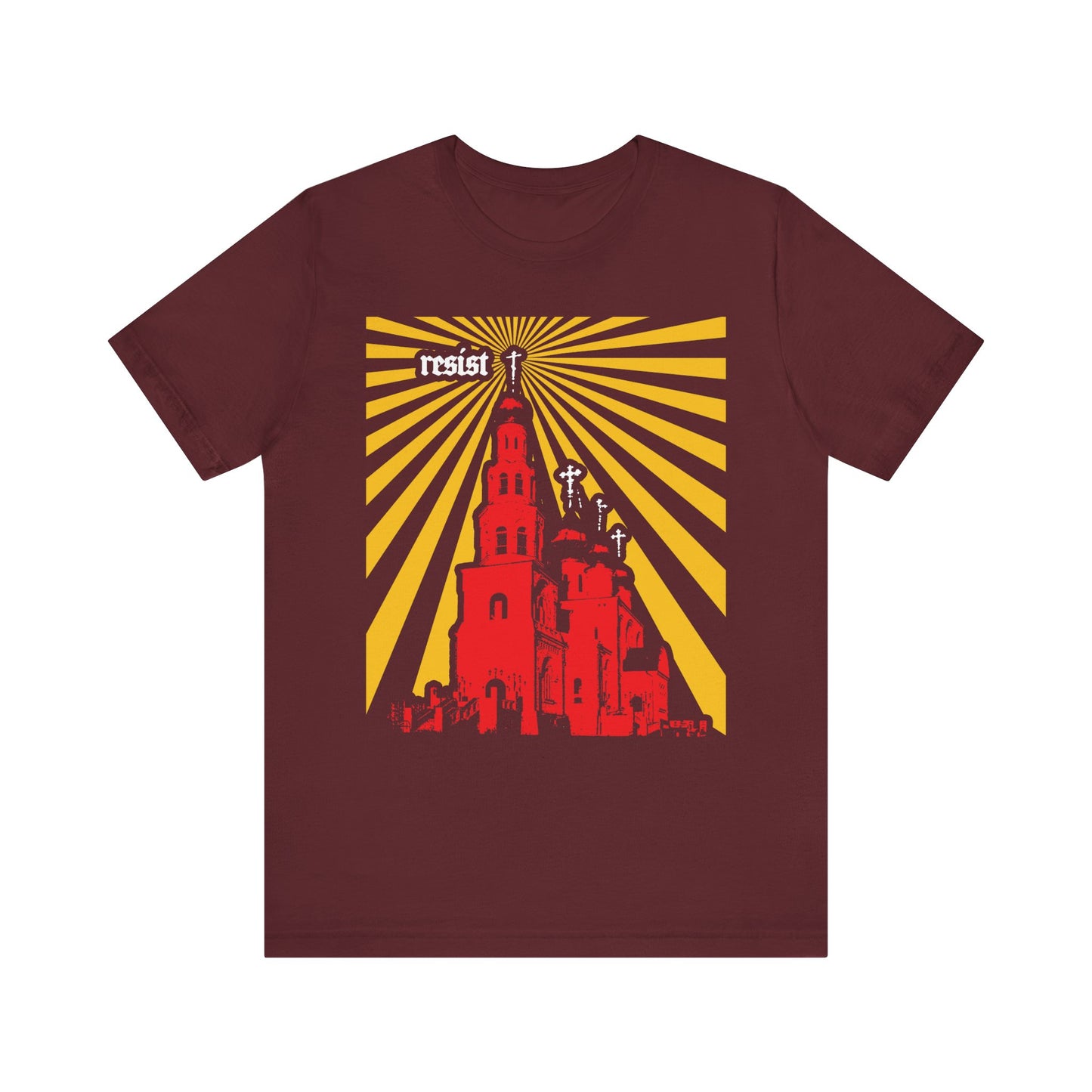 Maroon “Resist (Orthodoxy Against the World)” unisex tee: features a red church, yellow rays, three crosses, and the word “resist” in white at the top left—a bold Orthodox Christian design inspired by St. Ignatius Brianchaninov’s warnings against apostasy and emphasizing how the Orthodox Church stands as a beacon for the world.