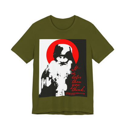 Olive T-shirt with a bold black, white, and red design of Fr Seraphim Rose, halo, and the phrase "It’s Later Than You Think”—a modern Orthodox Christian “Memento Mori” tee reflecting on spiritual life and mortality.
