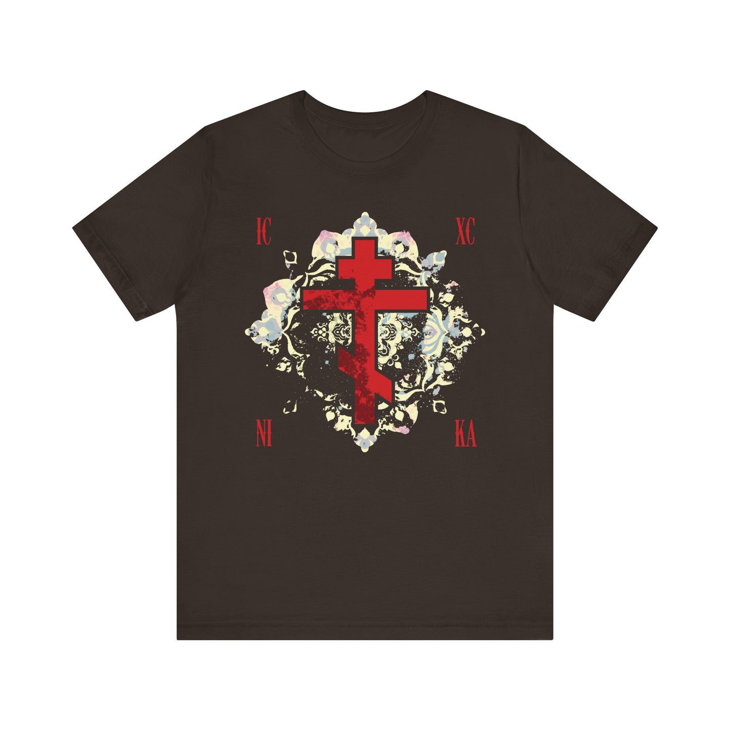 Brown unisex tee featuring "ICXC NIKA | Jesus Christ Conquers" with a textured red Orthodox cross and medieval floral background—a striking nod to spiritual warfare, inspired by St John of Kronstadt.
