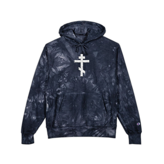 Navy tie-dye hoodie featuring an embroidered Orthodox tri-bar cross inspired by St. John of Kronstadt. "White Orthodox Cross | Unseen Warfare" heavy premium streetwear piece by Athletic Ascetic Christianity, shown on a white background.