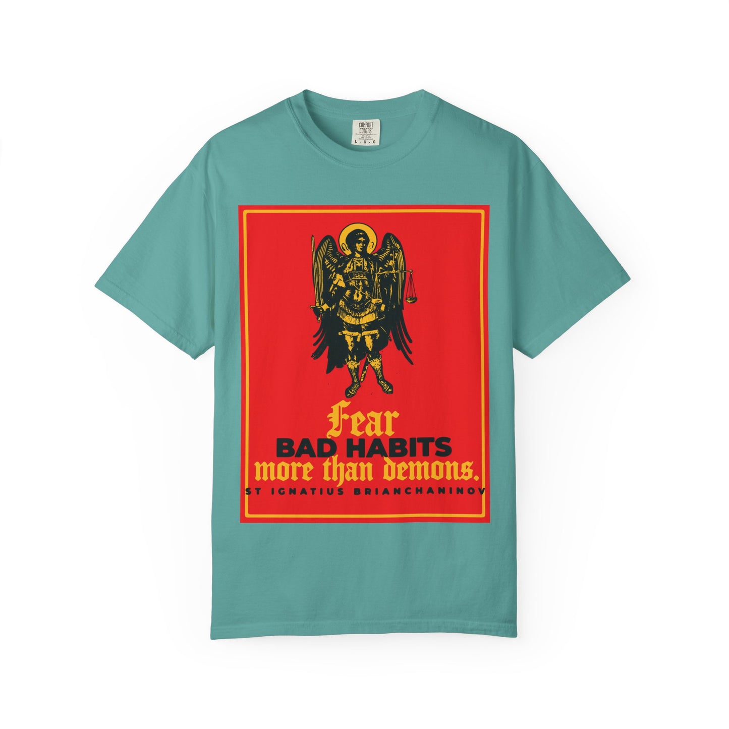 A seafoam heavyweight cotton unisex tee featuring an Archangel Michael iconographic image and the quote “Fear bad habits more than demons” by St Ignatius Brianchaninov—the perfect choice for anyone conscious of spiritual warfare and seeking moral freedom.