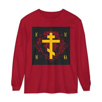 The ICXC NIKA Orthodox Christian red long sleeve shirt features a yellow Russian cross and Cyrillic letters on an ornate red background with a "Jesus Christ Conquers" design.