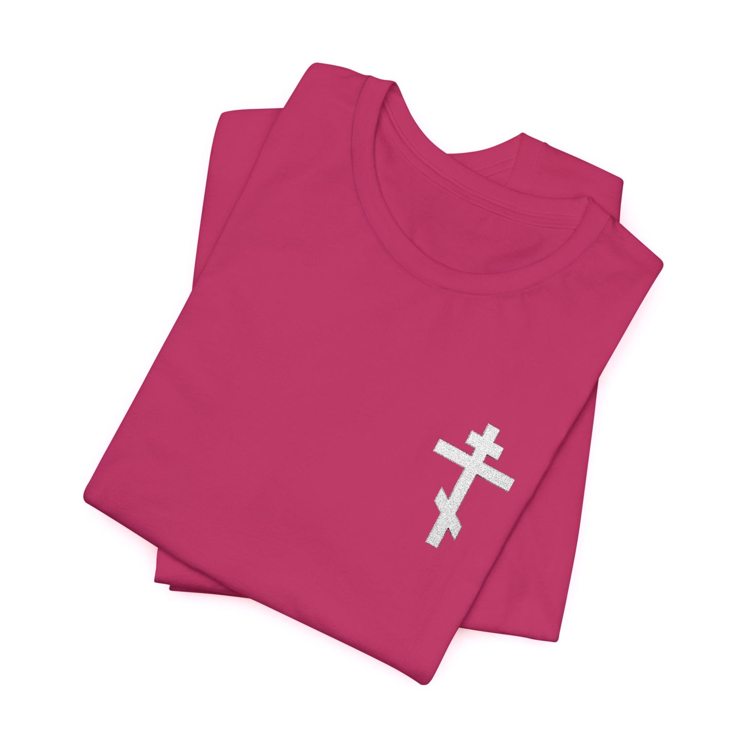 Small pink t-shirt featuring a white embroidered Orthodox cross and "May I Never Boast Except in the Cross of Our Lord Jesus Christ" (Gal 6:14)—ideal for Christian meditation and reflection.