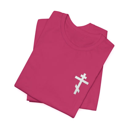 Small pink t-shirt featuring a white embroidered Orthodox cross and "May I Never Boast Except in the Cross of Our Lord Jesus Christ" (Gal 6:14)—ideal for Christian meditation and reflection.