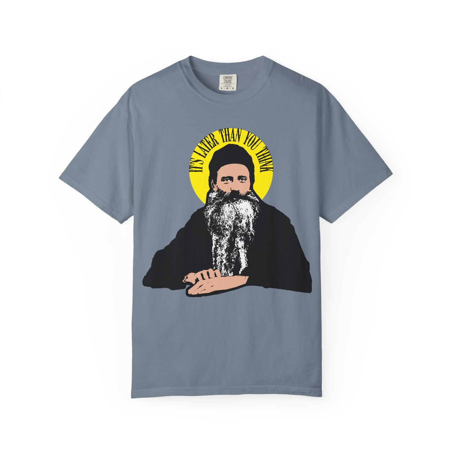 Blue Jean heavyweight cotton tee with Fr. Seraphim Rose quote in yellow halo. Features illustrated modern Orthodox saint and text: IT'S LATER THAN YOU THINK—a playful reminder of life’s brevity and reflection on mortality.
