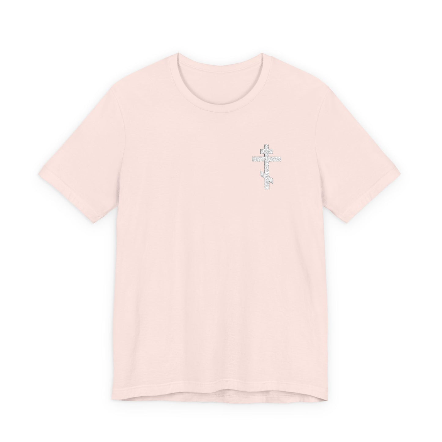 Soft pink unisex t-shirt featuring a small white embroidered Orthodox cross on the left chest and “May I Never Boast Except in the Cross (Gal 6:14),” made from premium cotton for a comfortable fit.