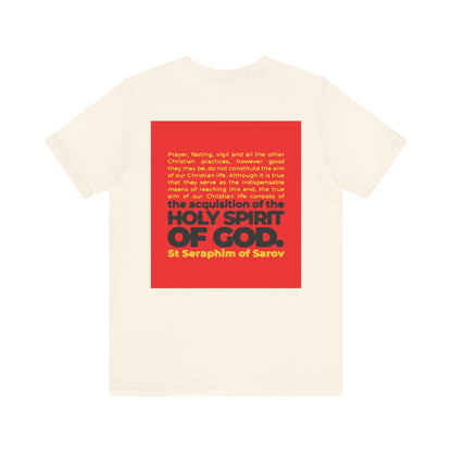 True Aim of Christian Life Tee: Cream cotton unisex shirt with a red square on the back featuring St. Seraphim of Sarov’s quote on acquiring the Holy Spirit. IconoGraphic Orthodox-inspired 2-sided lightweight design to inspire your faith.