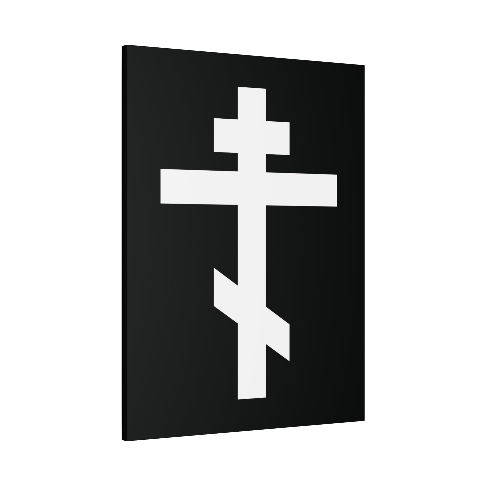 The "White Orthodox Cross | 'May I never boast, except in the cross of our Lord Jesus Christ' (Gal 6:14) | Orthodox Canvas Art" features a white Orthodox cross on a black rectangular background at a slight angle.