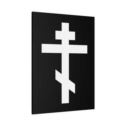 The "White Orthodox Cross | 'May I never boast, except in the cross of our Lord Jesus Christ' (Gal 6:14) | Orthodox Canvas Art" features a white Orthodox cross on a black rectangular background at a slight angle.