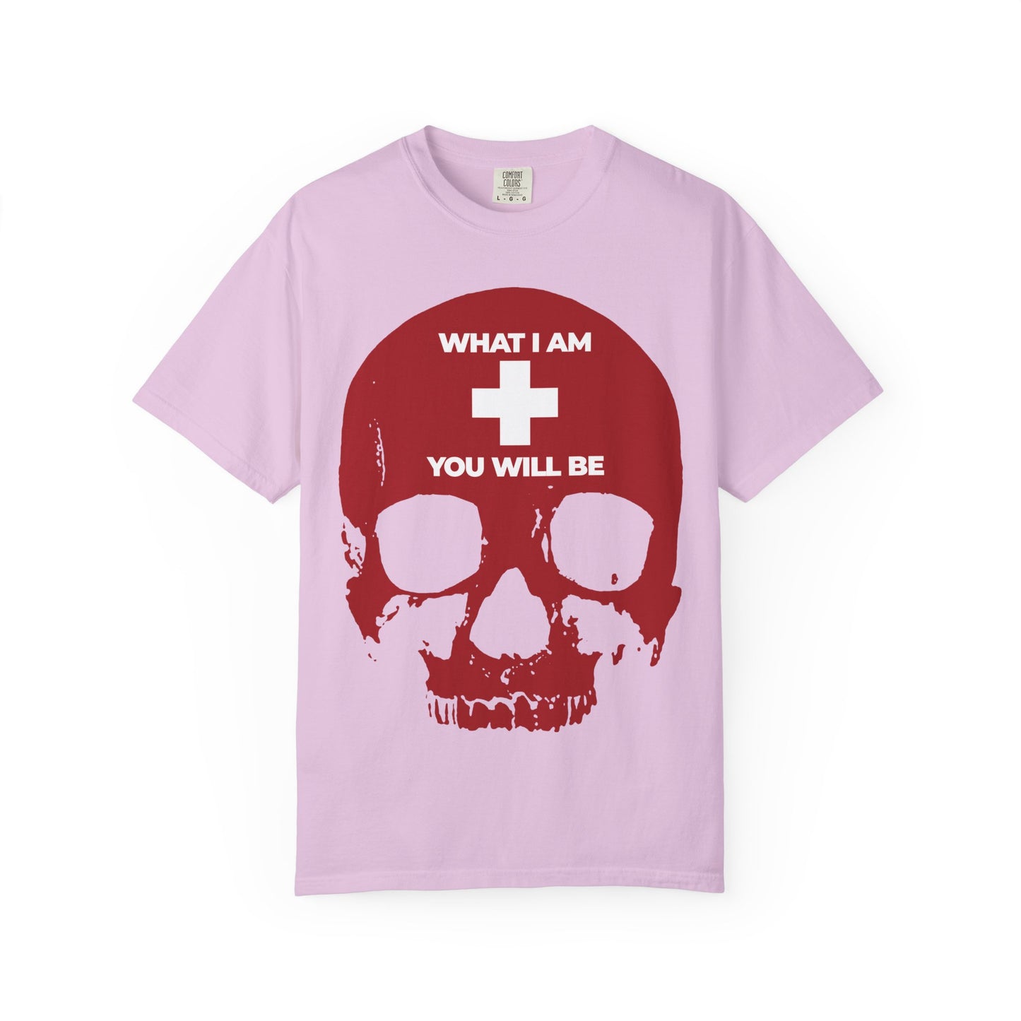 Orchid-colored heavyweight cotton unisex tee featuring a bold red skull with a white cross and the phrase "WHAT I AM YOU WILL BE," inspired by Orthodox Christian memento mori and echoing Ecclesiastes’ timeless reflection on life’s journey.