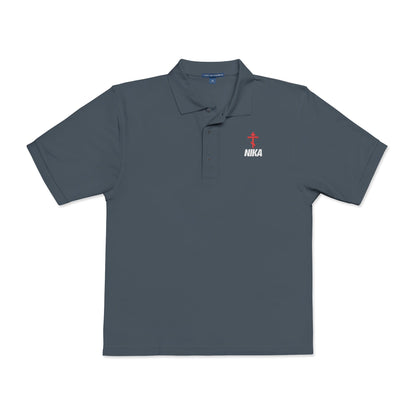 Steel grey polo shirt featuring a red Orthodox cross and white "NIKA" text on the left chest, inspired by the NIKE logo. Embroidered design reflects Christian faith: Jesus Christ Conquers—athletic ascetic fashion.
