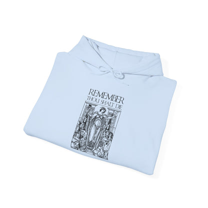 Folded white hoodie featuring a black classic woodcut-style illustration and the phrase “Remember You Will Die” in Shakespearean design, inspired by Orthodox Christian memento mori themes and evoking St. Ephraim the Syrian’s meditations on mortality.